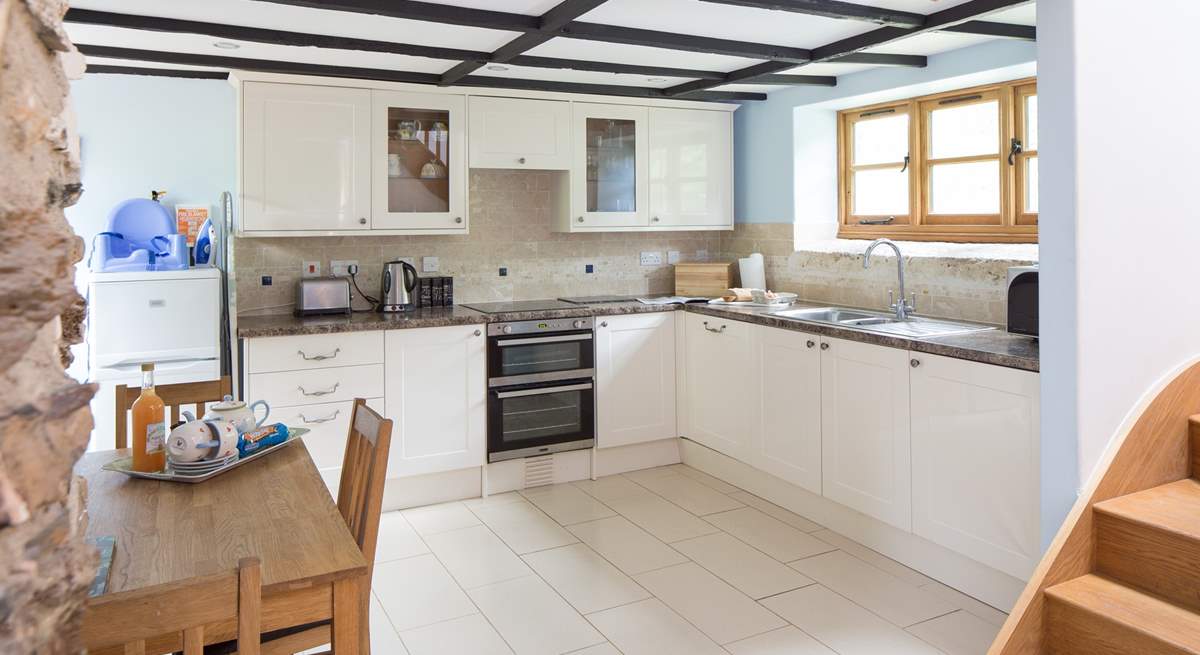 The well-equipped modern kitchen in a traditional barn.