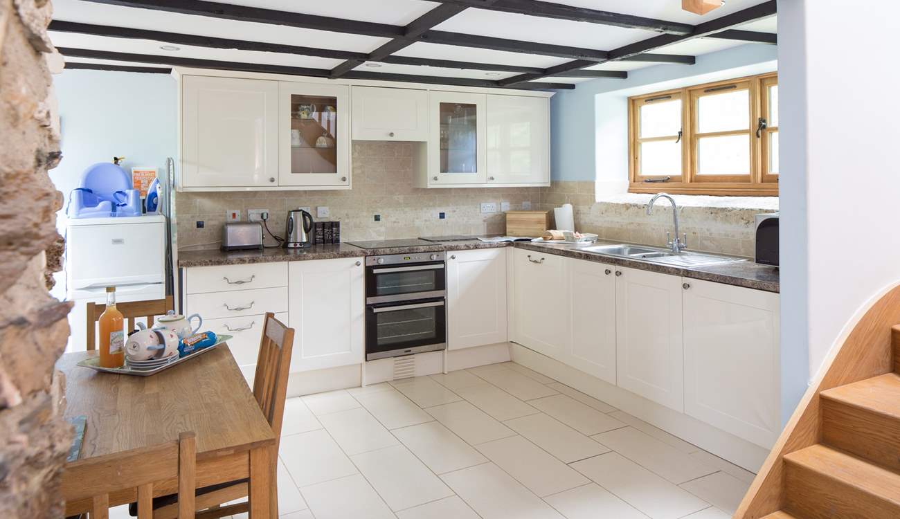 The well-equipped modern kitchen in a traditional barn.