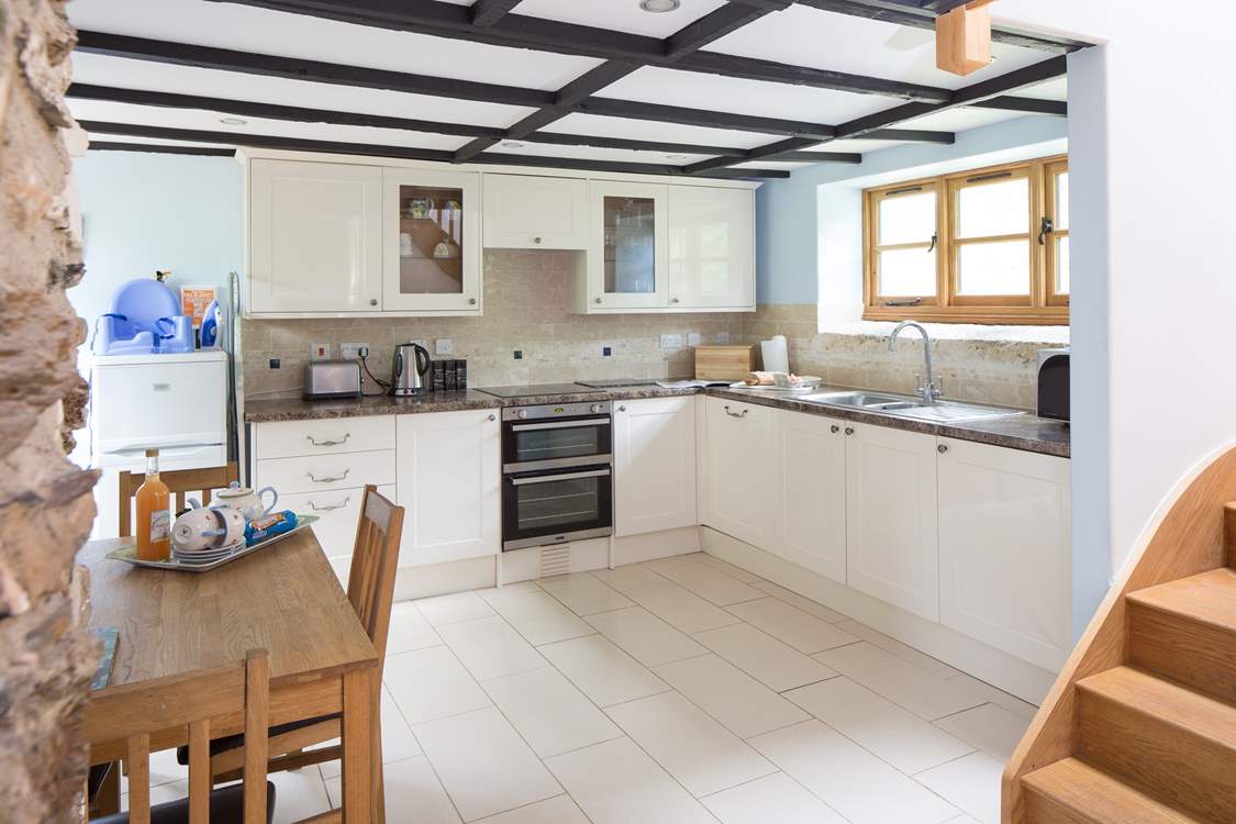 The well-equipped modern kitchen in a traditional barn.