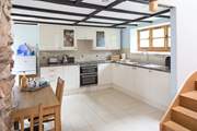 The well-equipped modern kitchen in a traditional barn.