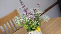 Pretty flowers on the table add welcome.