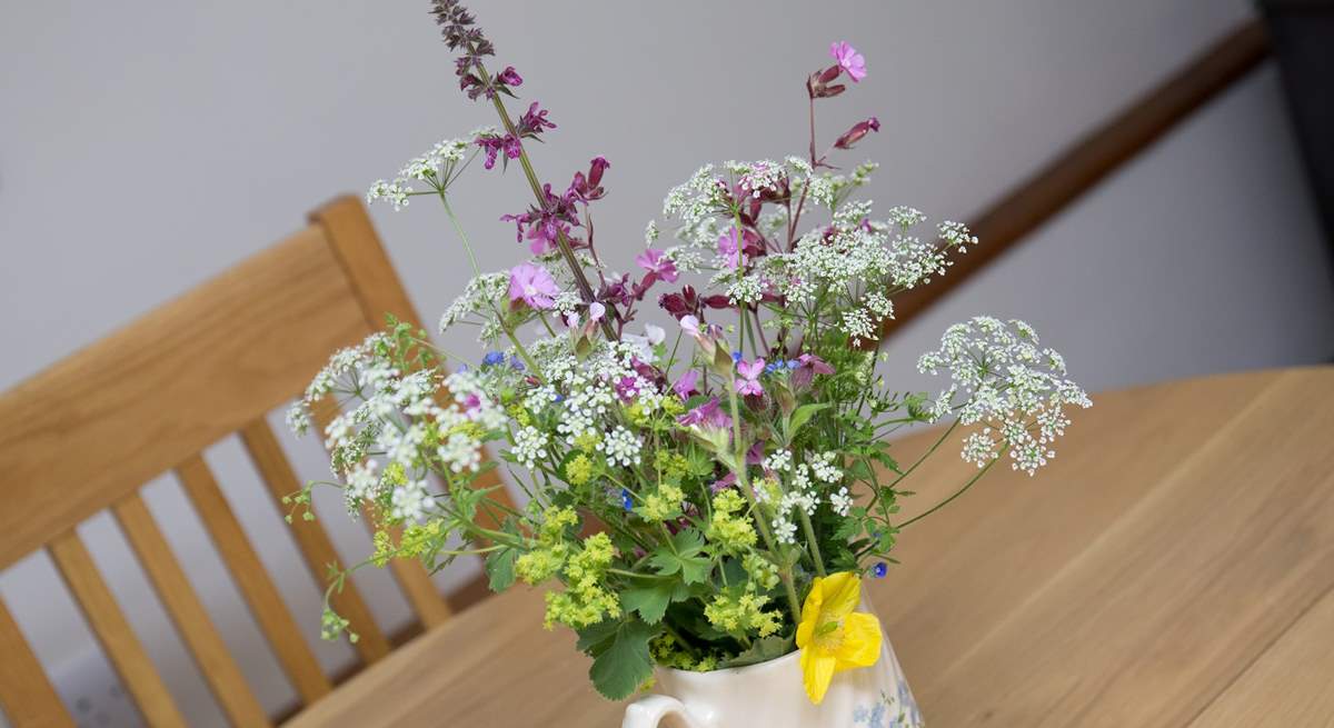 Pretty flowers on the table add welcome.