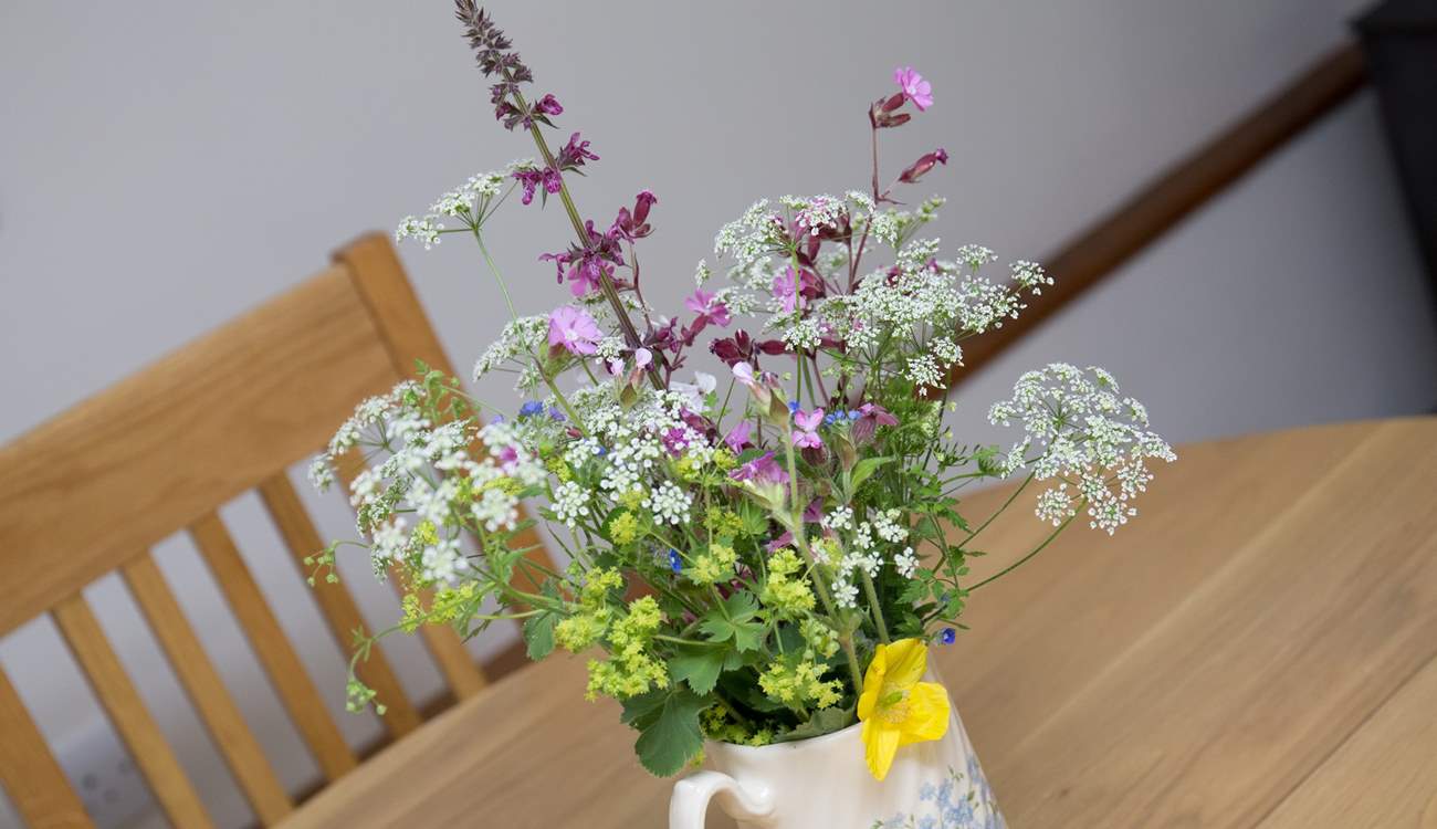 Pretty flowers on the table add welcome.