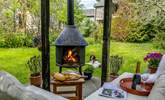 Set in the corner of the communal area you will find a beautiful log burner and seating area, perfect for those summer evenings whilst the children play with the guests staying at Fig Tree. - Thumbnail Image