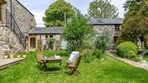Follow the path up through the communal garden to Horseshoe Cottage.