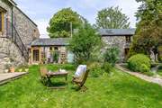Follow the path up through the communal garden area to Horseshoe Cottage.