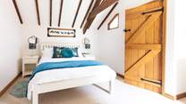 An inviting double bed sits in the centre of bedroom 1.