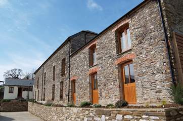 The front of the cottage is on the right, with the owners' museum (not open to the public) next door and a little annexe to the main farmhouse at the top.