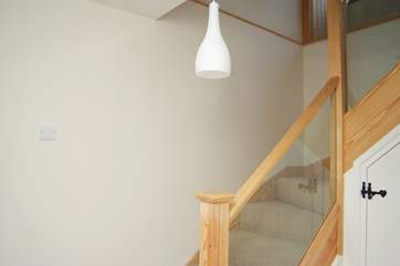 The turned staircase leading down to the bedroom from the entrance hall.