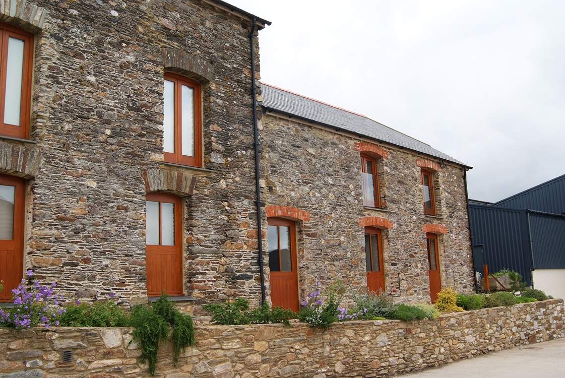 The owners' transport museum (not open to the public) on the left with the cottage to the right.