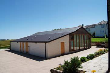 Guests can use the extensive gardens of the farmhouse, seen here behind the pool-room.
