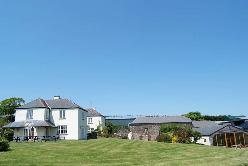 From left to right: Aveton Farmhouse, the annexe, the owners' museum (not open to the public), the pool-room, gym and games-room with the roof of Aveton Cottage behind.