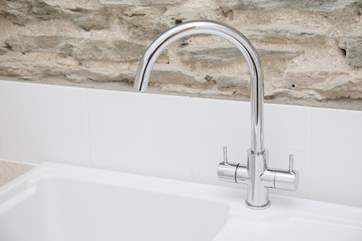 Sparkling taps and sink in the kitchen.