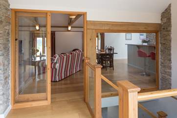 The entrance hall has glazed doors into the living-room.
