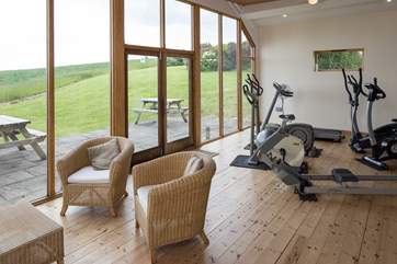 The small gym is equipped with a rowing machine, running machine, elliptical trainer and two exercise bikes.