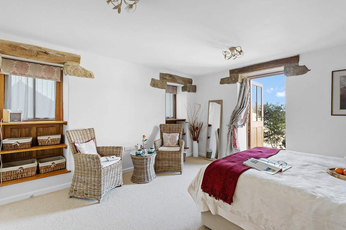 Bedroom one is light and airy.