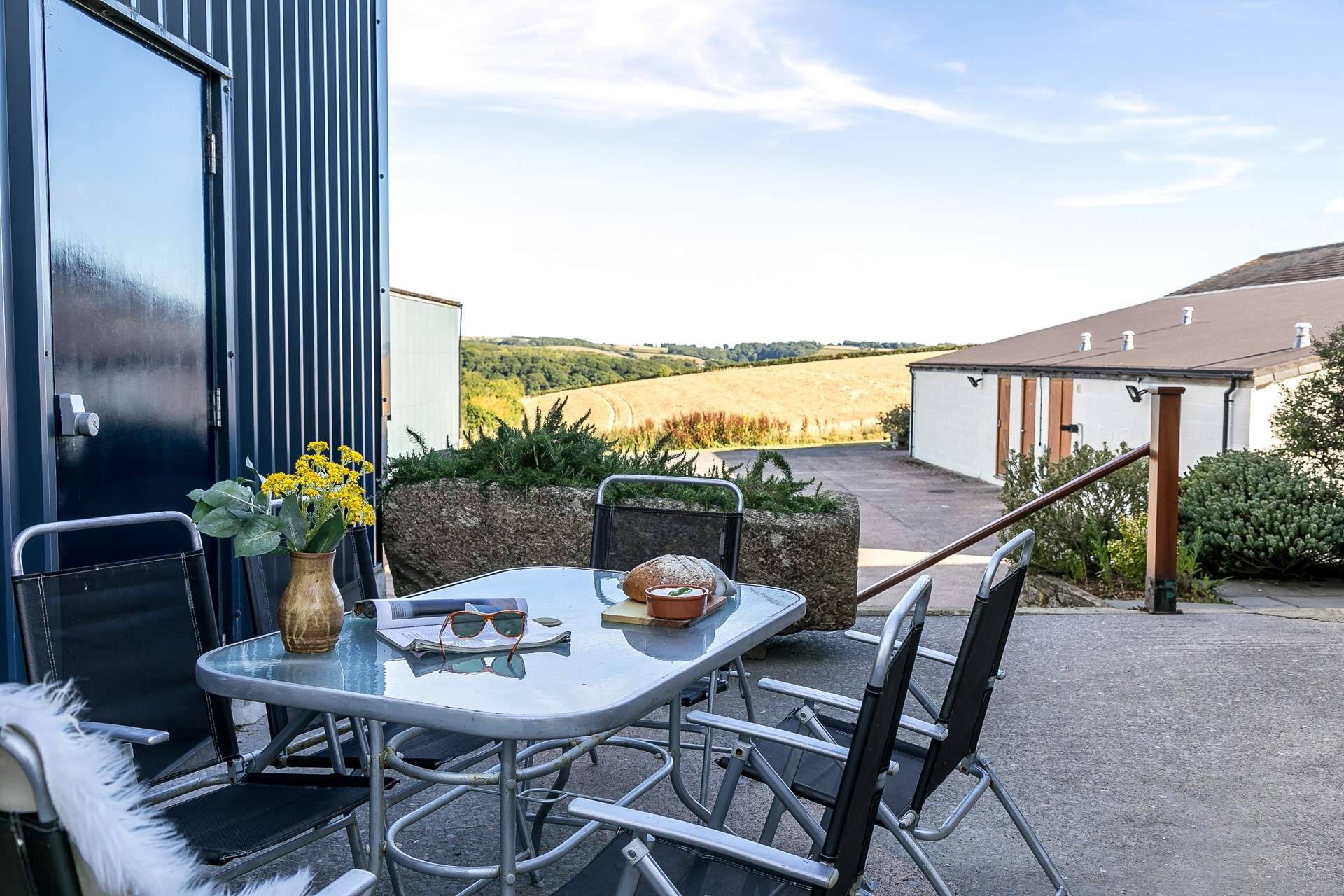 There is a small patio outside the cottage.