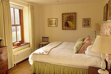 The master bedroom overlooks the valley towards the sea.