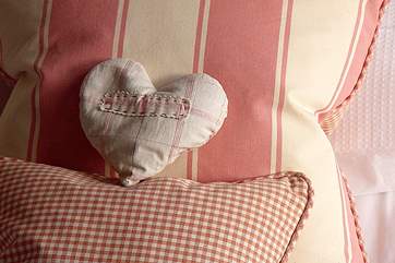 Pretty fabrics are seen throughout the house.