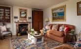 Relax by the wood burner on the comfy sofa. - Thumbnail Image