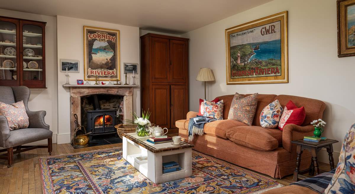 Relax by the wood burner on the comfy sofa.