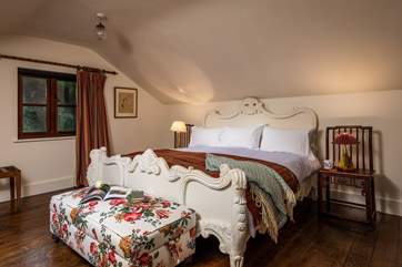 Warm and rich interiors make this double bedroom very cosy.