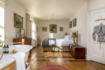 The master bedroom is beautifully finished and enjoys stunning views across the valley.