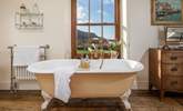 The bath in the master bedroom en suite is an old roll-top bath with Victorian hand shower attachment. - Thumbnail Image