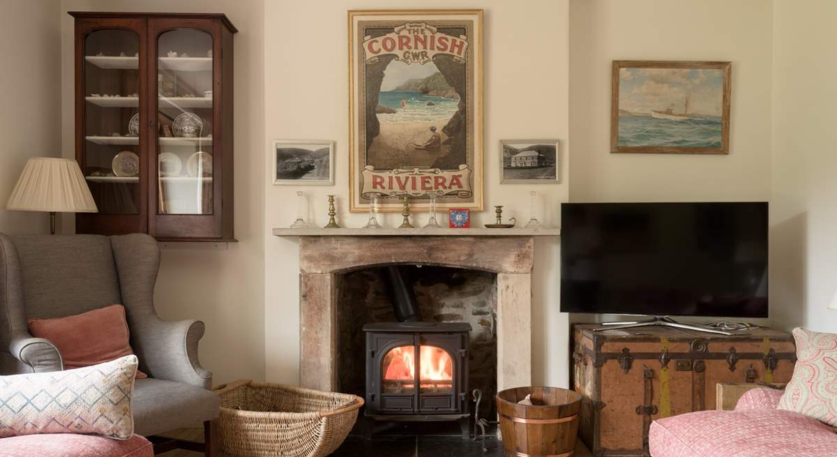 Snuggle up by the wood-burner in cooler months in the second sitting room. 