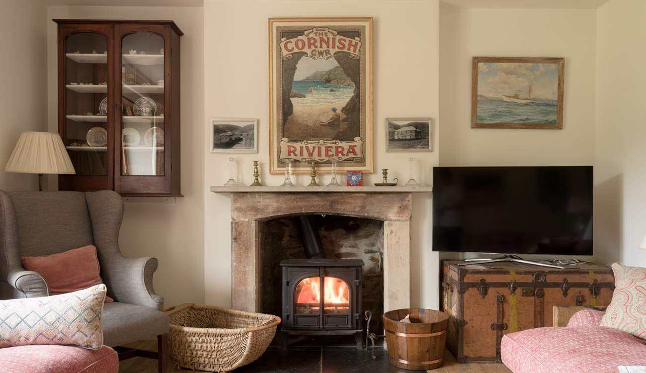 Snuggle up by the wood-burner in cooler months in the second sitting-room. 