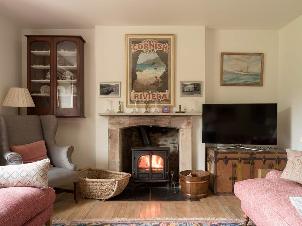 Snuggle up by the wood-burner in cooler months in the second sitting room.