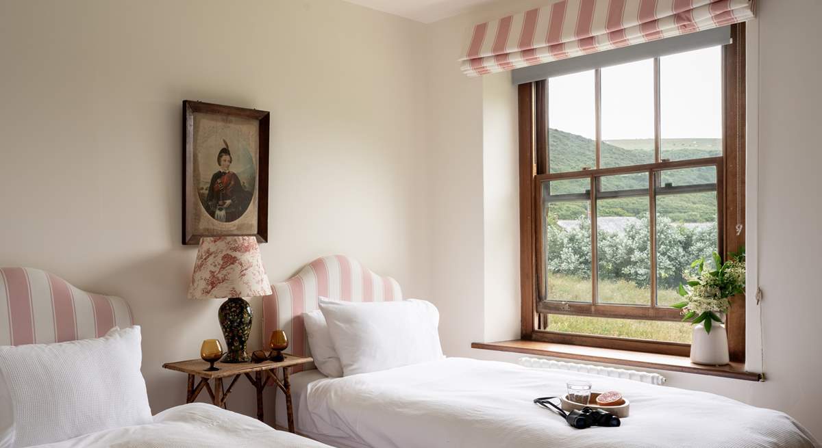 The pink twin bedroom is oh so pretty. 