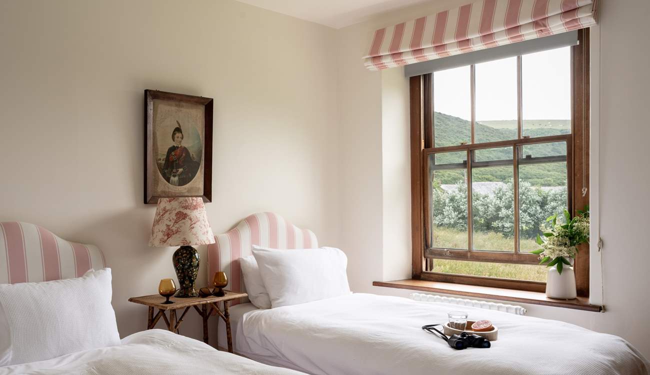 The pink twin bedroom is oh so pretty. 