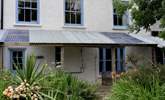 The covered porch area to the rear.  - Thumbnail Image