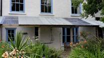 The covered porch to the rear. 