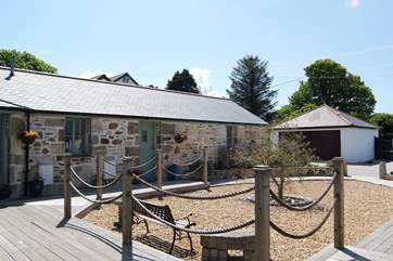 The cottage is just across the deck from the hot tub enclosure.