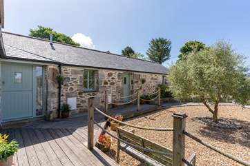 The cottage is just across the deck from the hot tub enclosure.