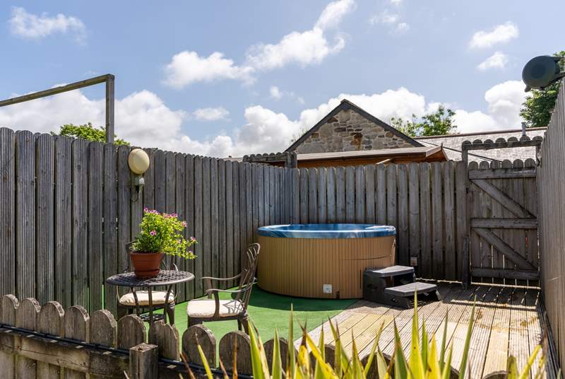Poppy's hot tub and deck is a short stroll across the courtyard. (Please note there is an additional charge for the hot tub).