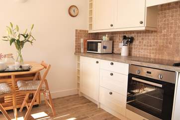 Room to cook and dine in this open plan living, eating, relaxing space.