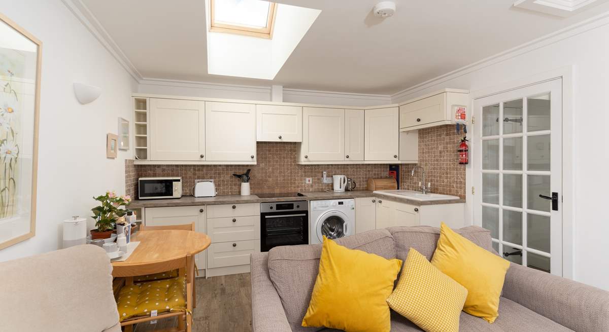 Room to cook and dine in this open plan living, eating, relaxing space.