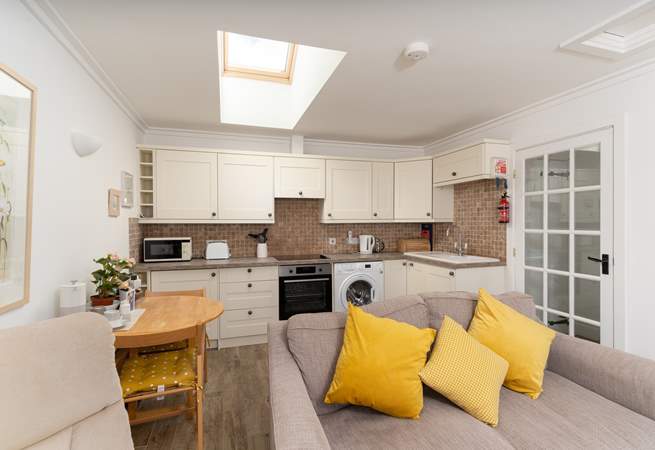 Room to cook and dine in this open plan living, eating, relaxing space.