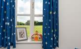 The single bedroom overlooks the field behind. - Thumbnail Image