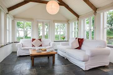 The sun-room is the ideal place to sit back and relax and take in the glorious setting.