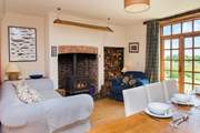 You can enjoy time in front of the wood-burner in the main living-room and watch the cooks at work!