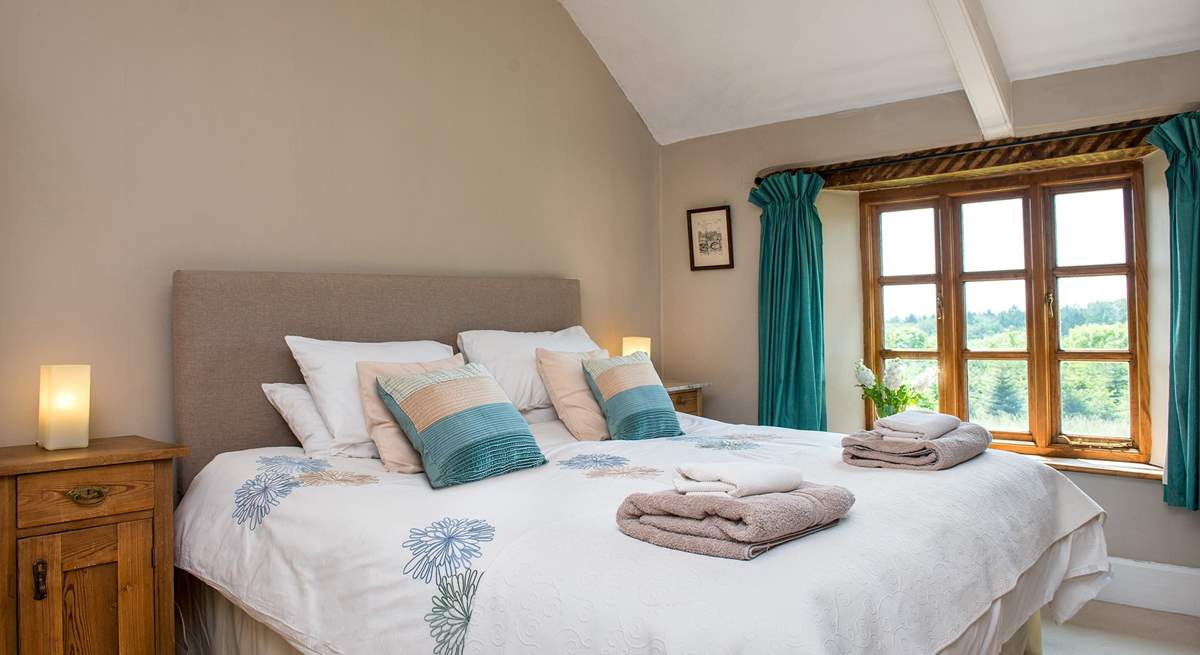 Bedroom 1 is beautifully furnished and enjoys views over the garden.