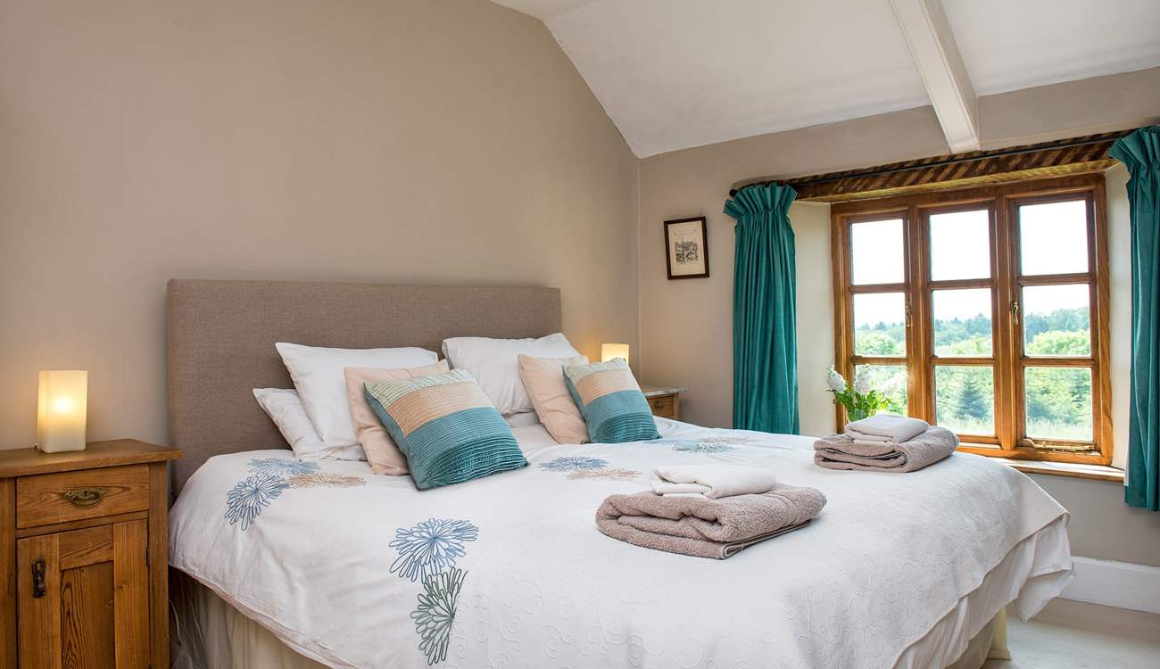 Bedroom 1 is beautifully furnished and enjoys views over the garden.