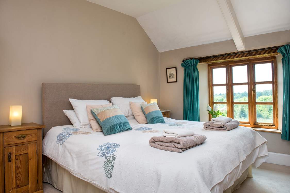 Bedroom 1 is beautifully furnished and enjoys views over the garden.