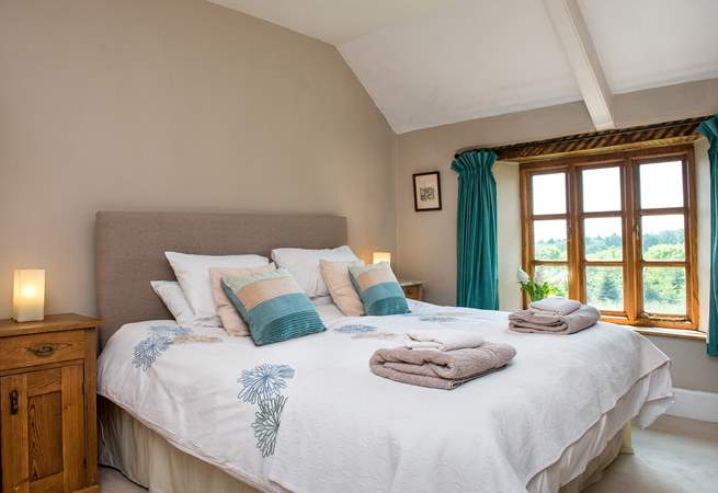 Bedroom 1 is beautifully furnished and enjoys views over the garden.