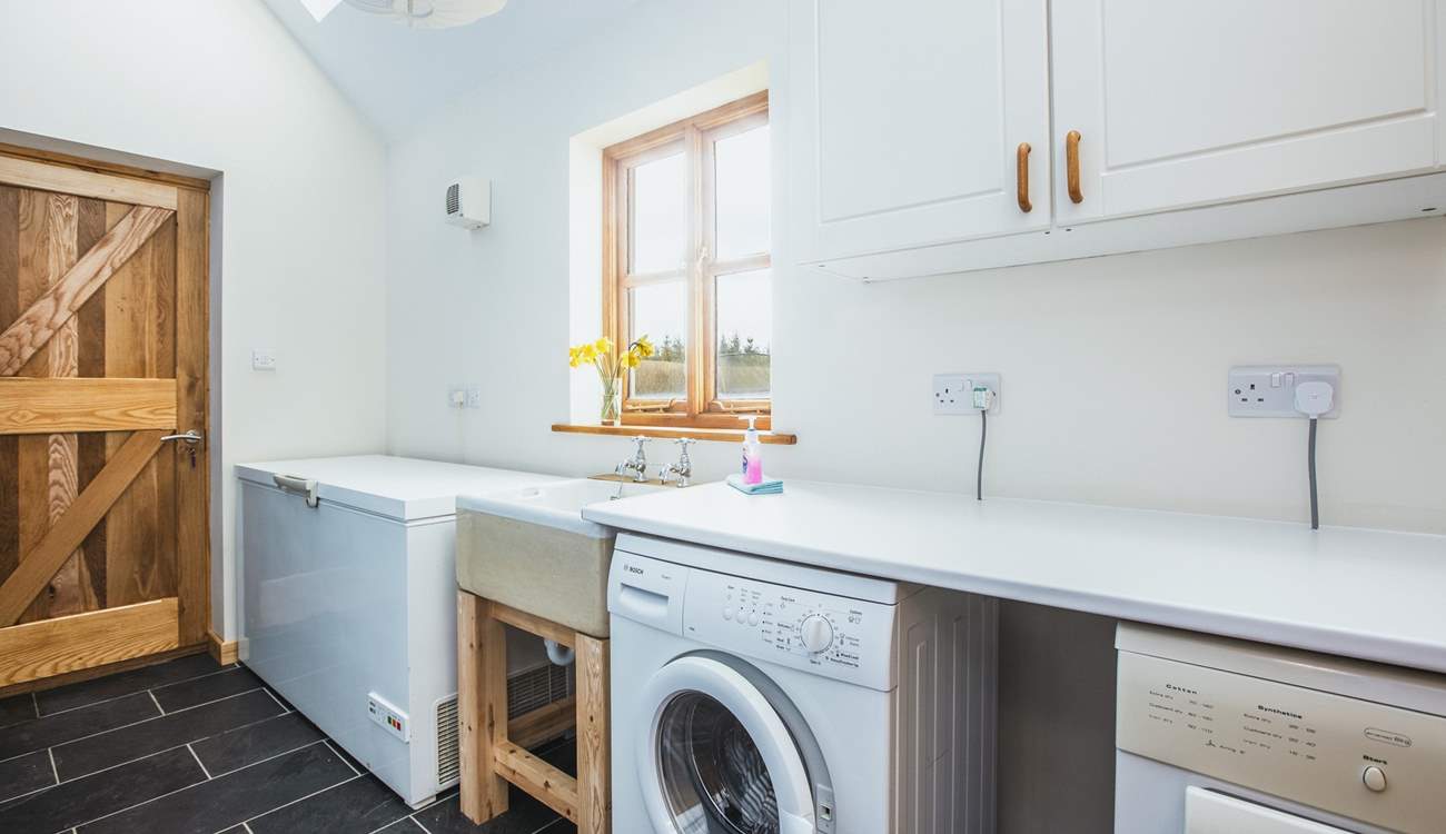 There is a handy utility area with access to the garden, a perfect room for extra storage and of course the essential washing facilities. 