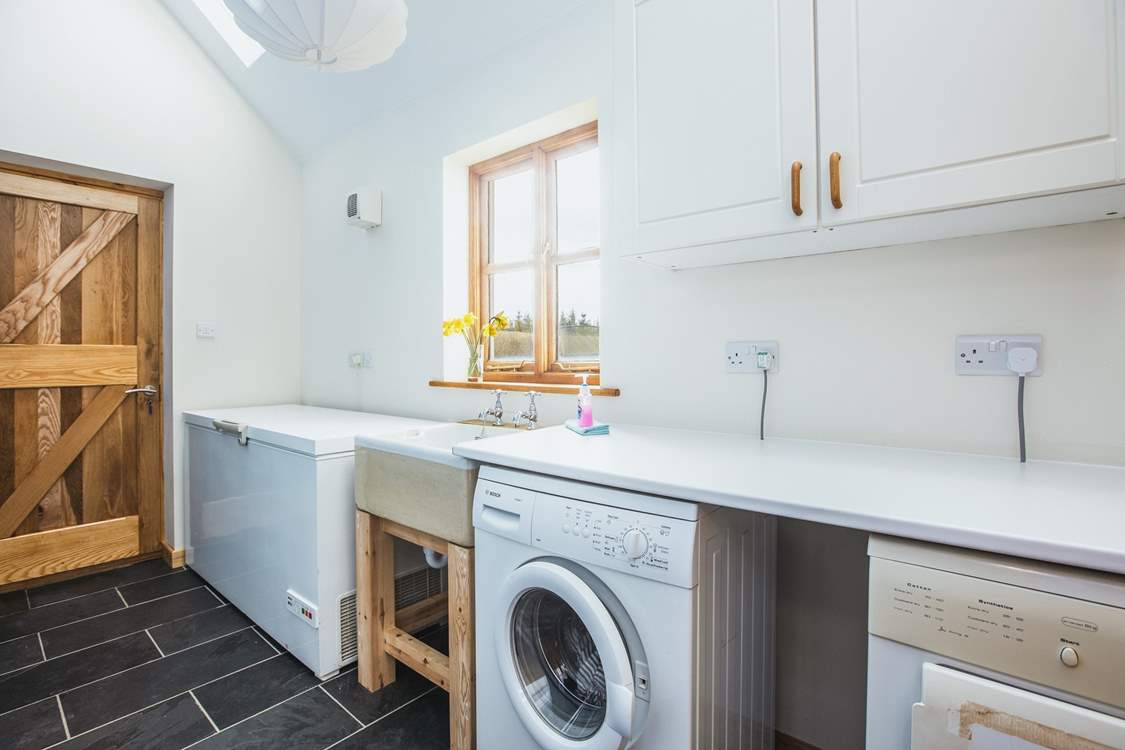 There is a handy utility area with access to the garden, a perfect room for extra storage and of course the essential washing facilities.